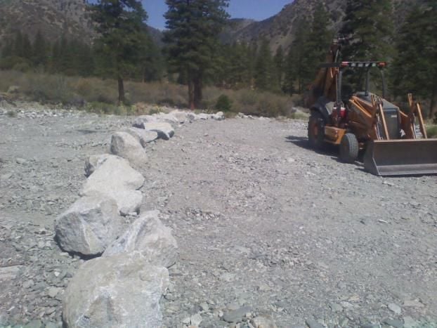Pile Of Rocks And Backhoe